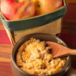 Photograph of a basket of red and yellow apples representing healthy holiday food including Apple crisp