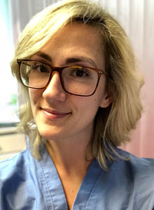 Dr Chris Cherubino in blue scrubs at Cherubino Health Center