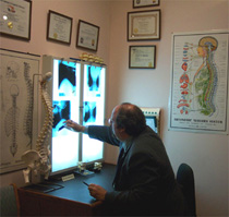 Dr Ron Viewbox Dr Ron Cherubino evaluating xrays on viewbox at Cherubino Health Center
