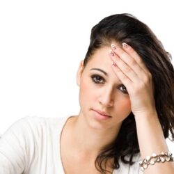 chronic fatigue adrenal glands Young woman suffering with chronic fatigue from exhaustion of adrenal glands with hand on her head