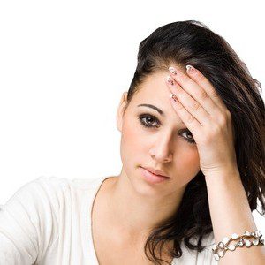 chronic fatigue adrenal glands Young woman suffering with chronic fatigue from exhaustion of adrenal glands with hand on her head