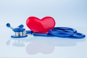 3-D drawing of a red heart on a blue stethoscope representing freedom from heart disease and benefits of HIIT Exercise